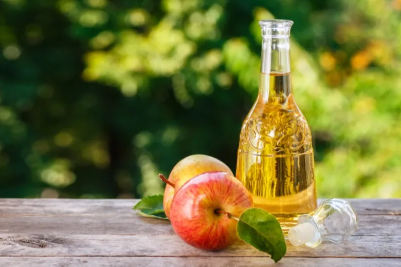 apple vinegar on wood table