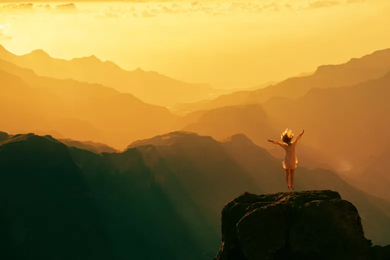 lady standing on a cliff