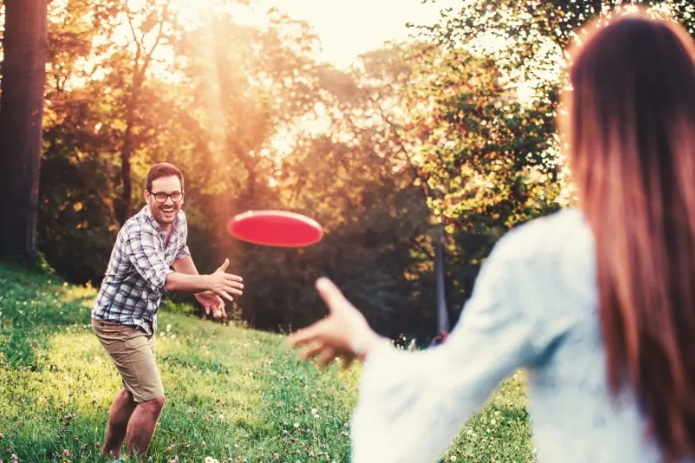 A couple playing frisbee