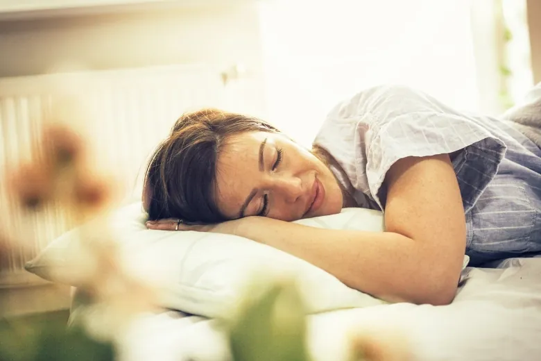 girl sleeping on pillow