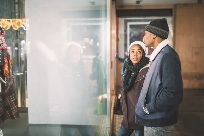 men and women checking out a store